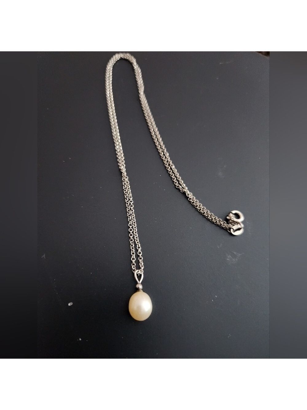Genuine pearl necklace on with sterling bale & chain